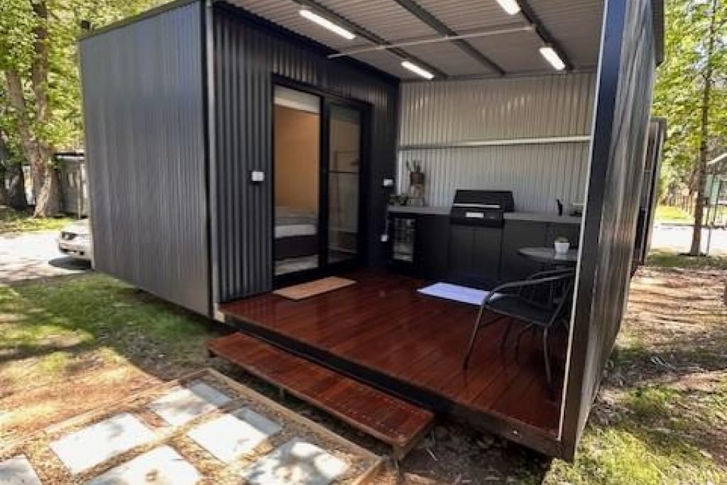 Modern cube cabin with outdoor kitchen and deck at Bright Accommodation Park, Bright VIC