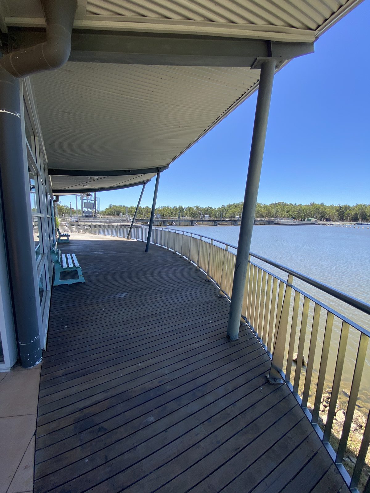 Covered boardwalk lookout curving above the murray river at Torrumbarry Weir Holiday Park