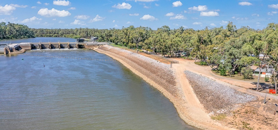 Aerial view of the Torrumbarry Weir on the Murray River beside the river gum-lined caravan park at Torrumbarry Weir Holiday Park, Patho VIC