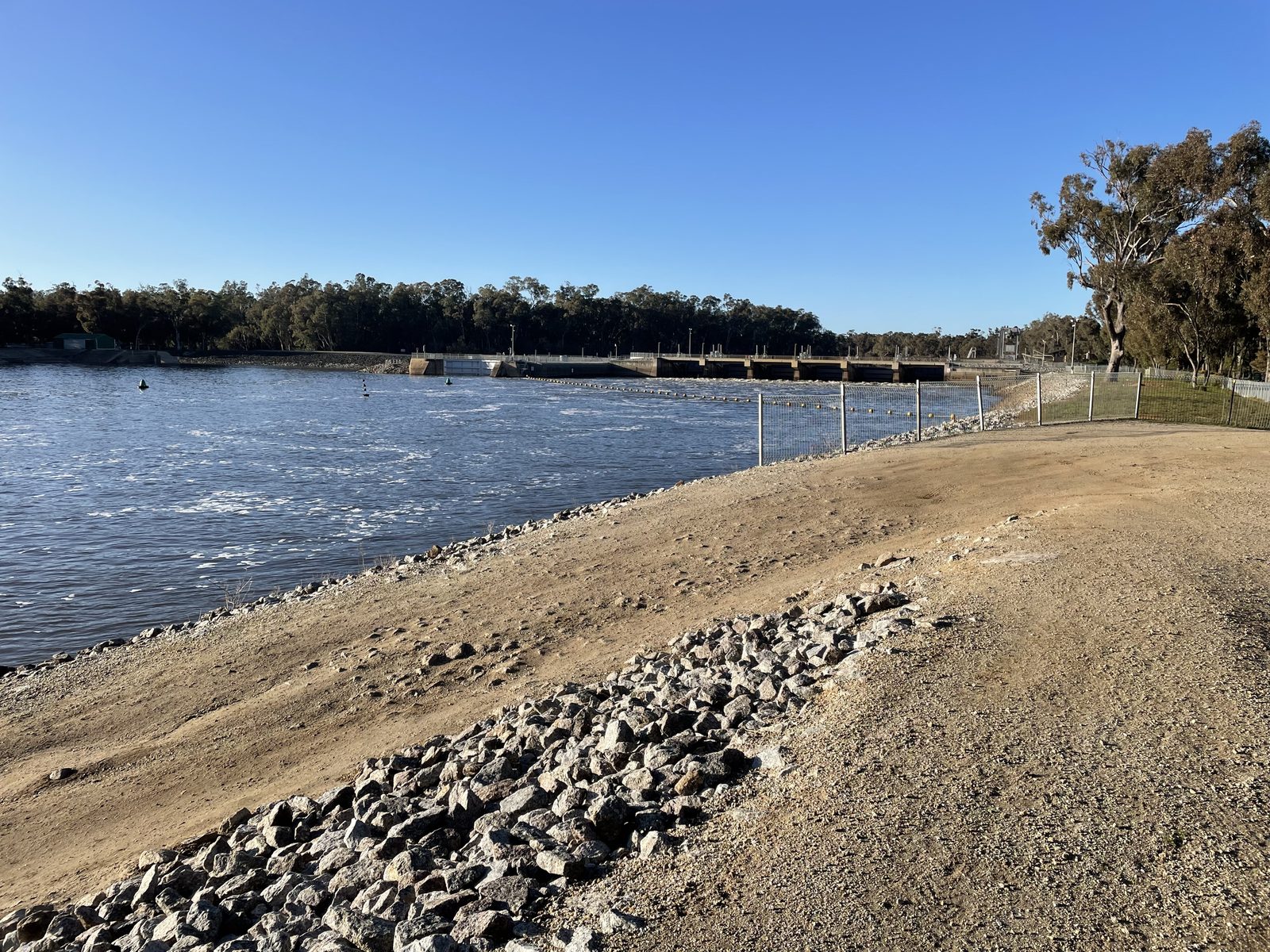 Murray river above the weir seen from the rocky gravel bank at Torrumbarry Weir Holiday Park