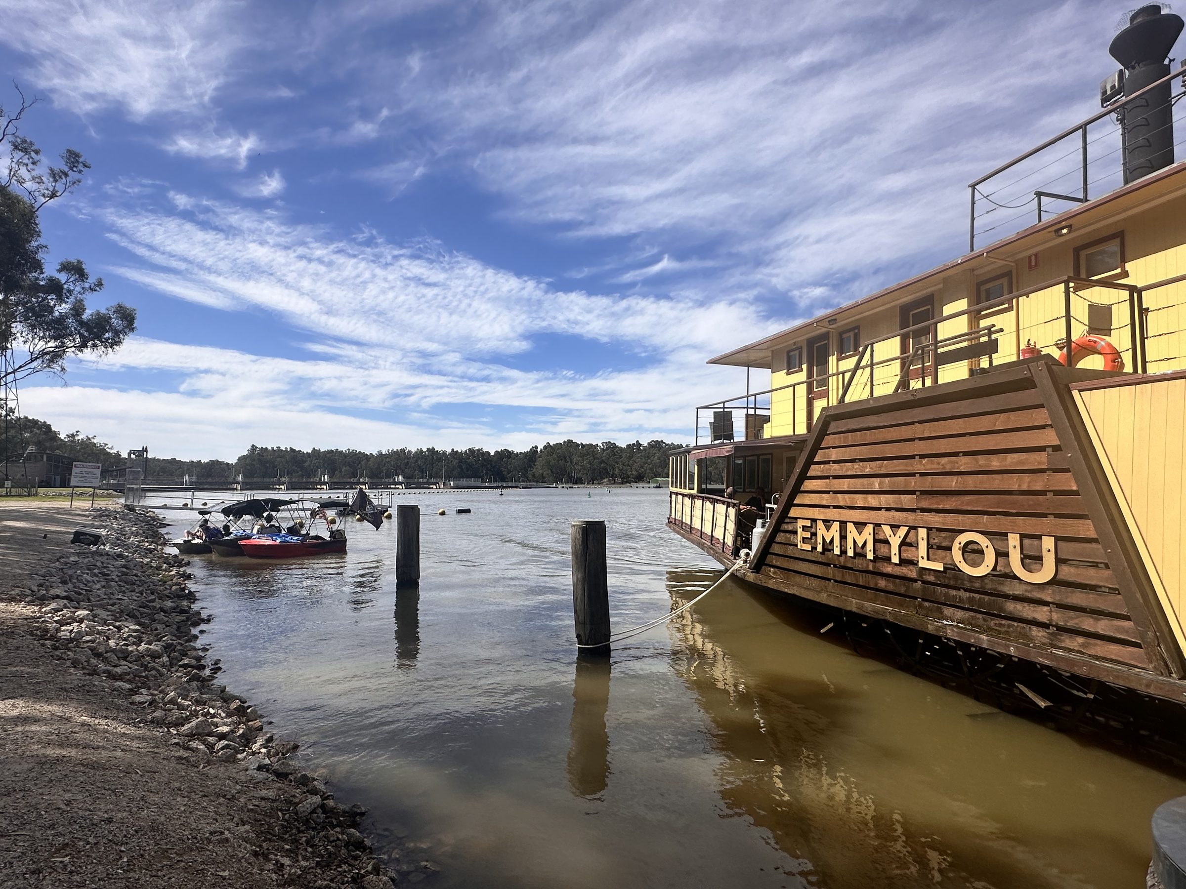 Paddlesteamer emmylou moored at old pylons under a big sky at Torrumbarry Weir Holiday Park