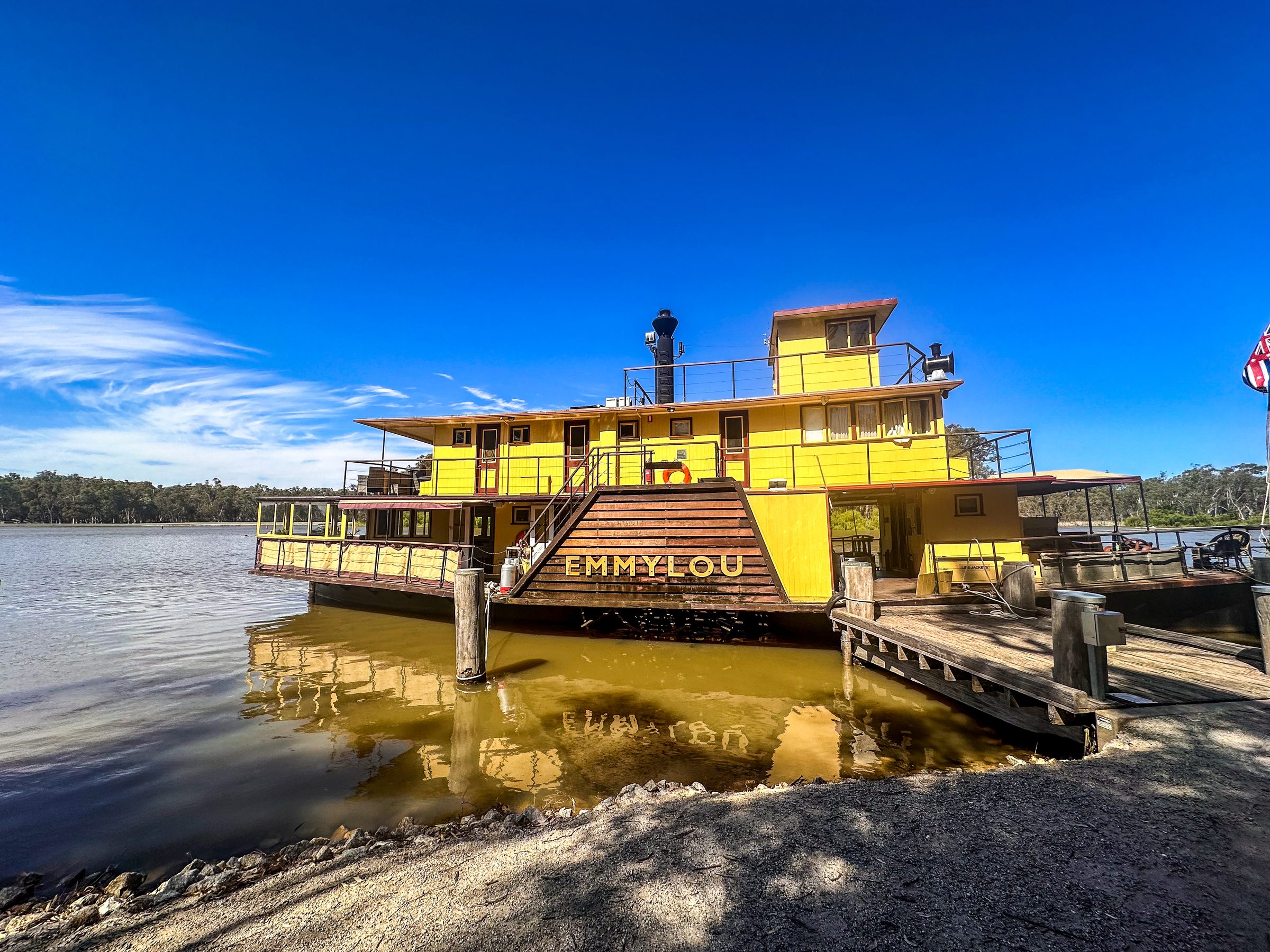 Paddlesteamer emmylou moored at the bank with gangway down at Torrumbarry Weir Holiday Park