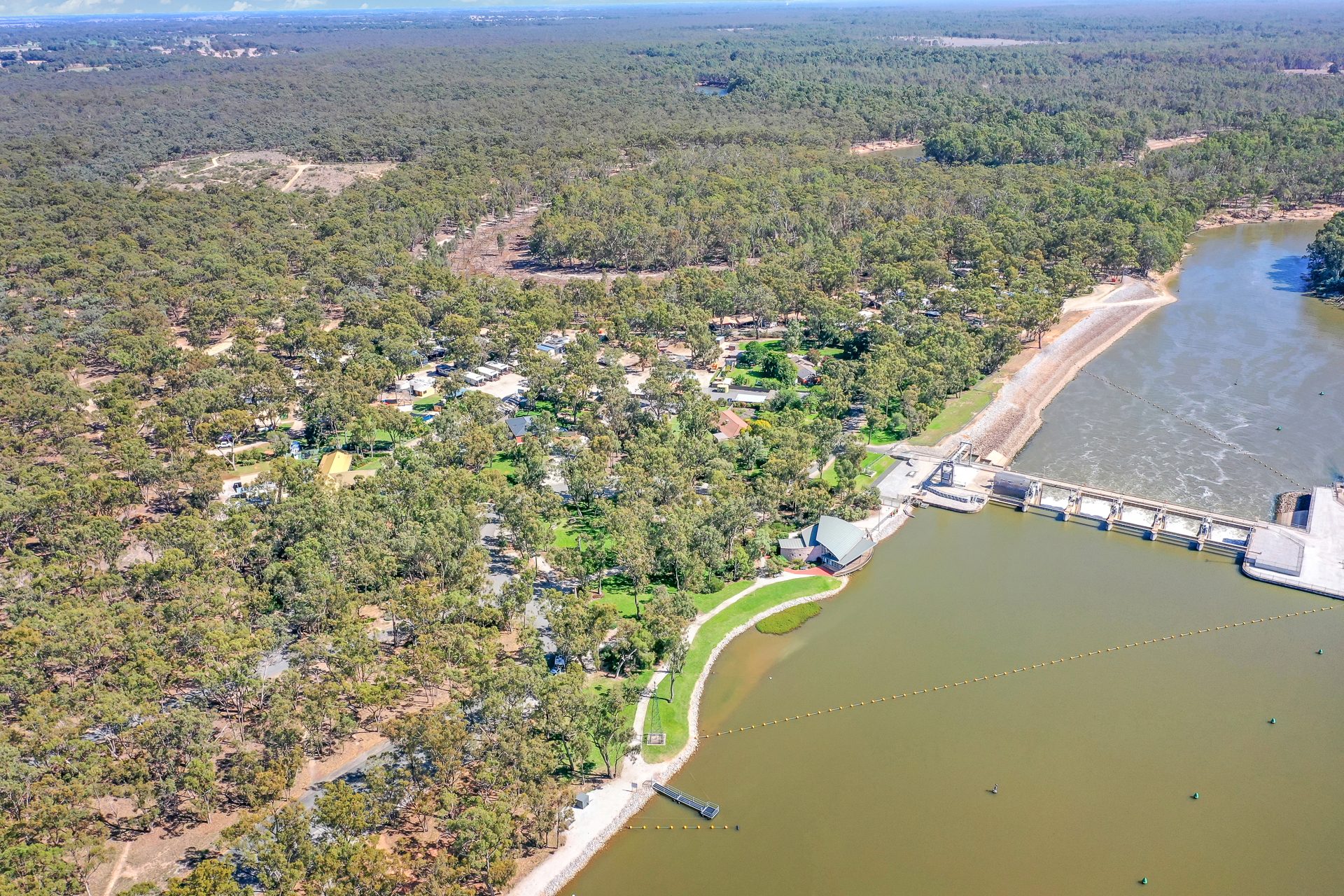 Aerial of holiday park along the river beside torrumbarry weir at Torrumbarry Weir Holiday Park
