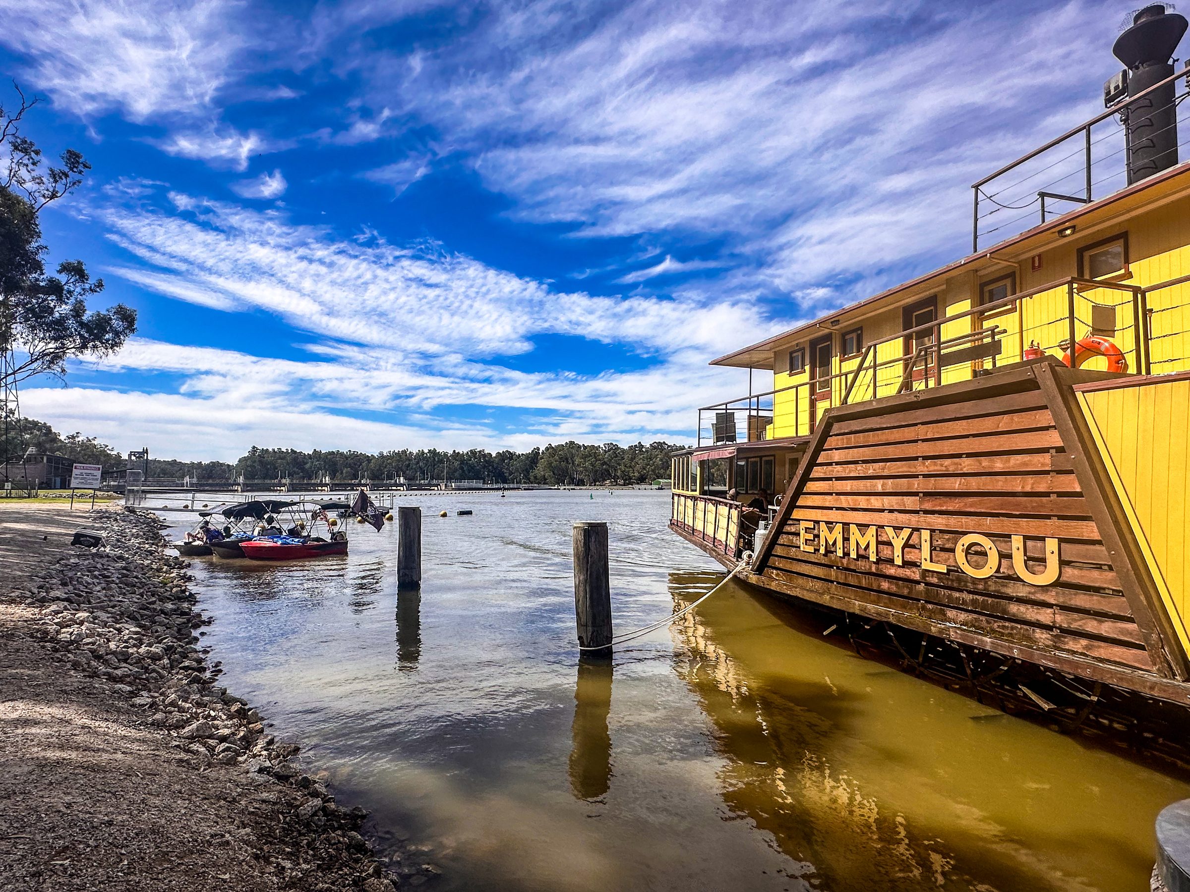 Paddlesteamer emmylou moored at pylons under a big blue sky at Torrumbarry Weir Holiday Park