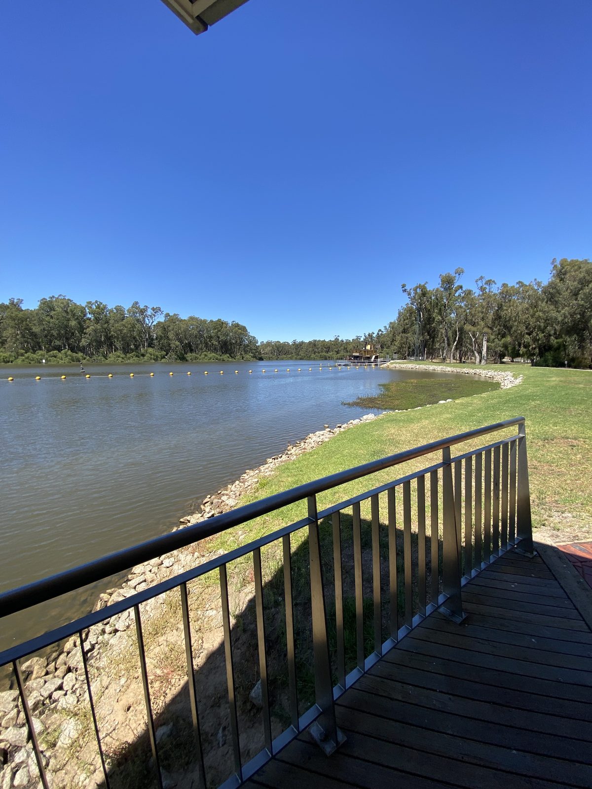 Wide bend of the murray river viewed from the boardwalk at Torrumbarry Weir Holiday Park